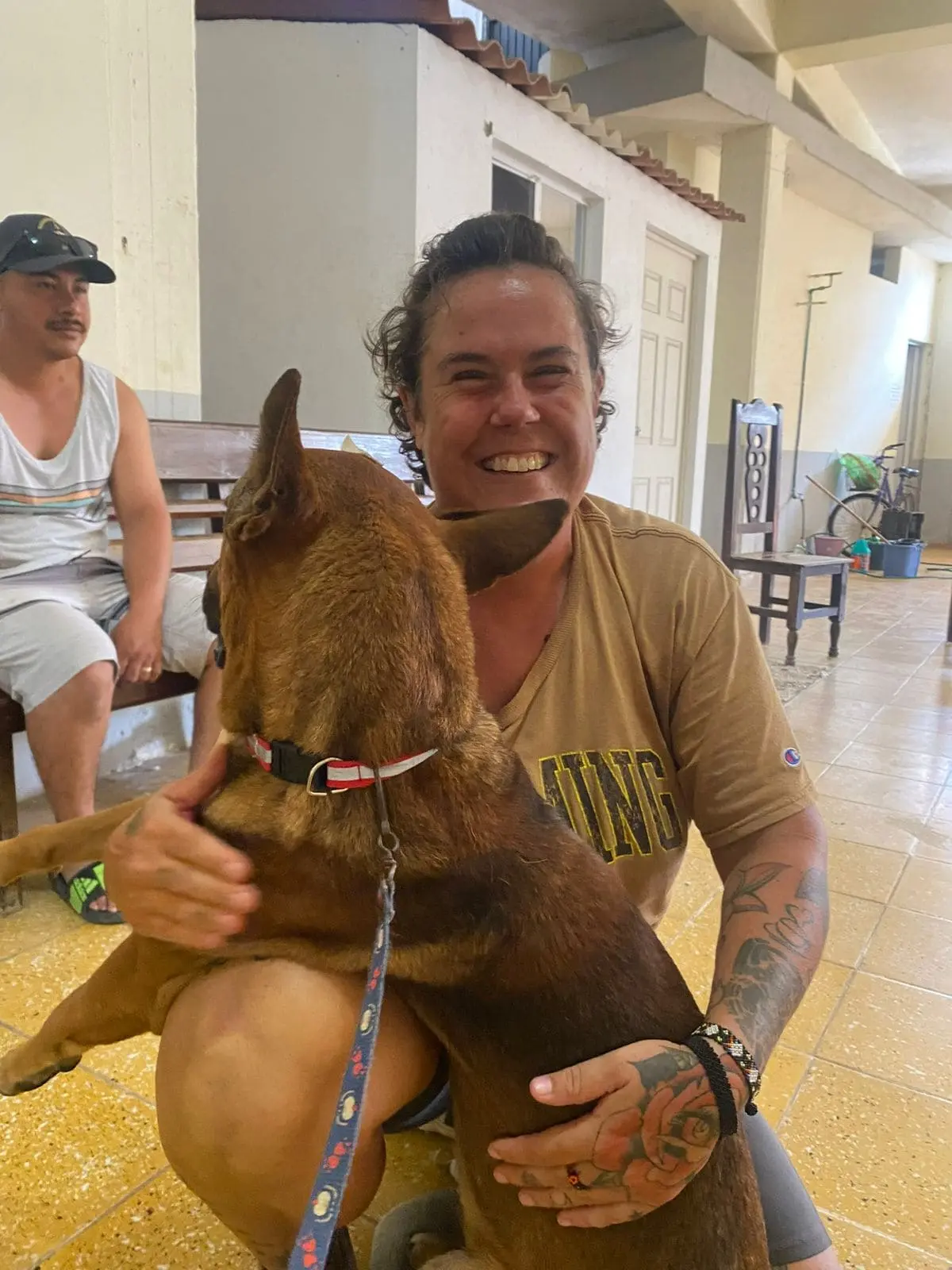 A smiling women with a dog 